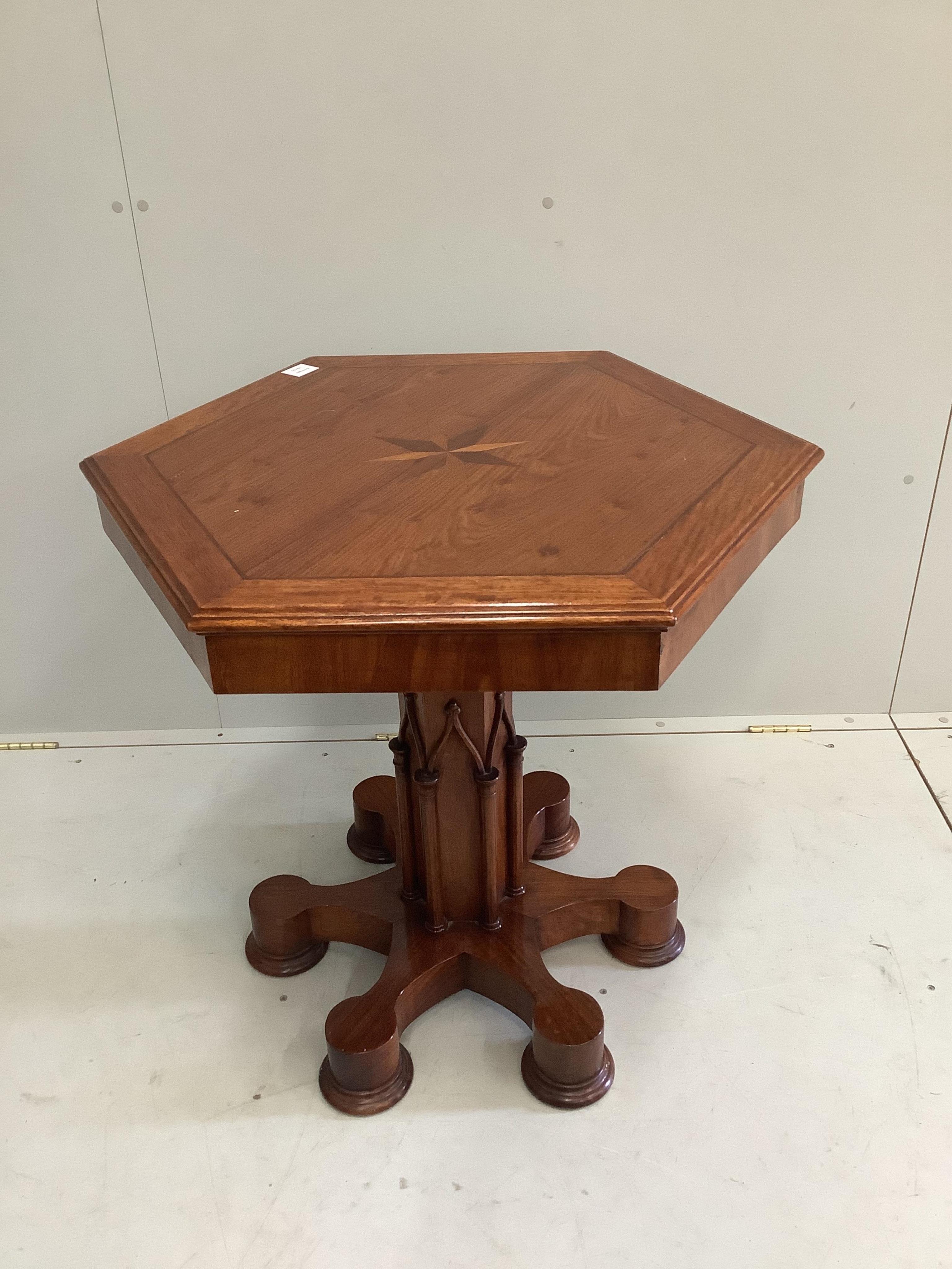 A Gothic style mahogany parquetry inlaid hexagonal centre table, width 81cm, height 75cm. Condition - fair